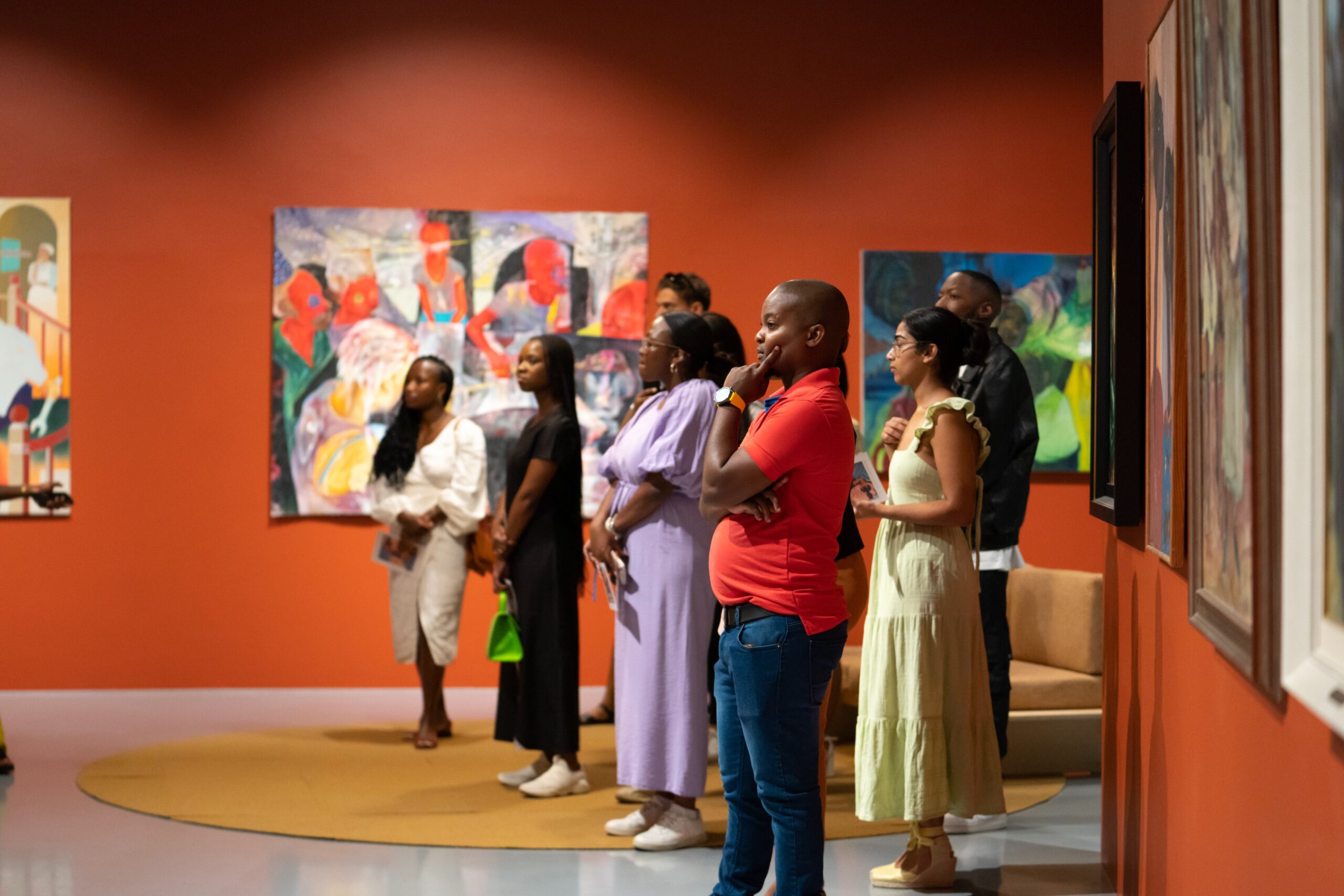 BMW Young Collectors Co. members walk through the exhibition When We See Us at Zeitz MOCAA. (Courtesy of BMW Young Collectors Co.)
