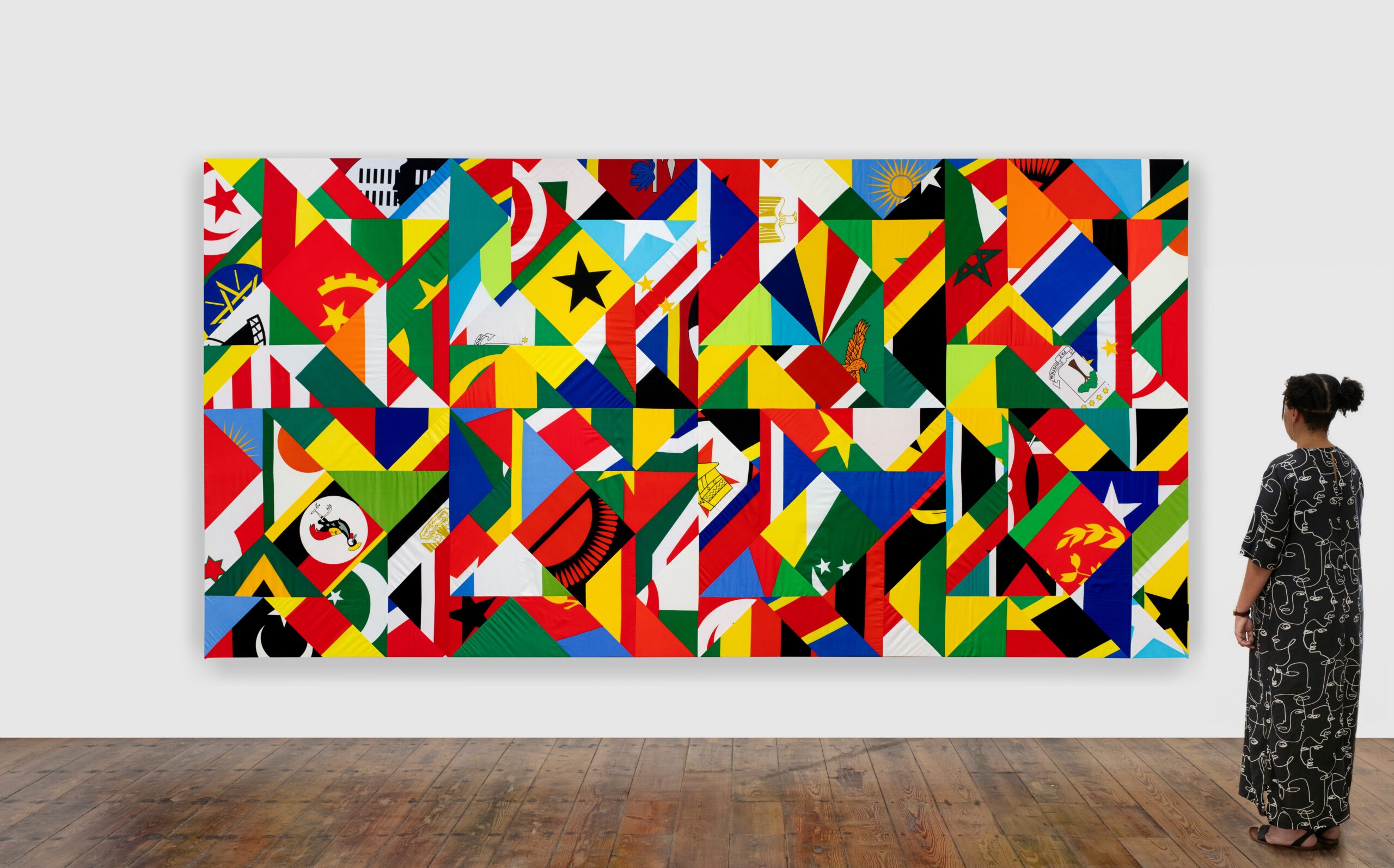 Hank Willis Thomas. Tomorrow, The United States of Africa, 2023. Mixed media including contemporary African National flags. Unframed:214 x 423.5 cm. (Photography by Nina Lieska/ Courtesy of Goodman Gallery)