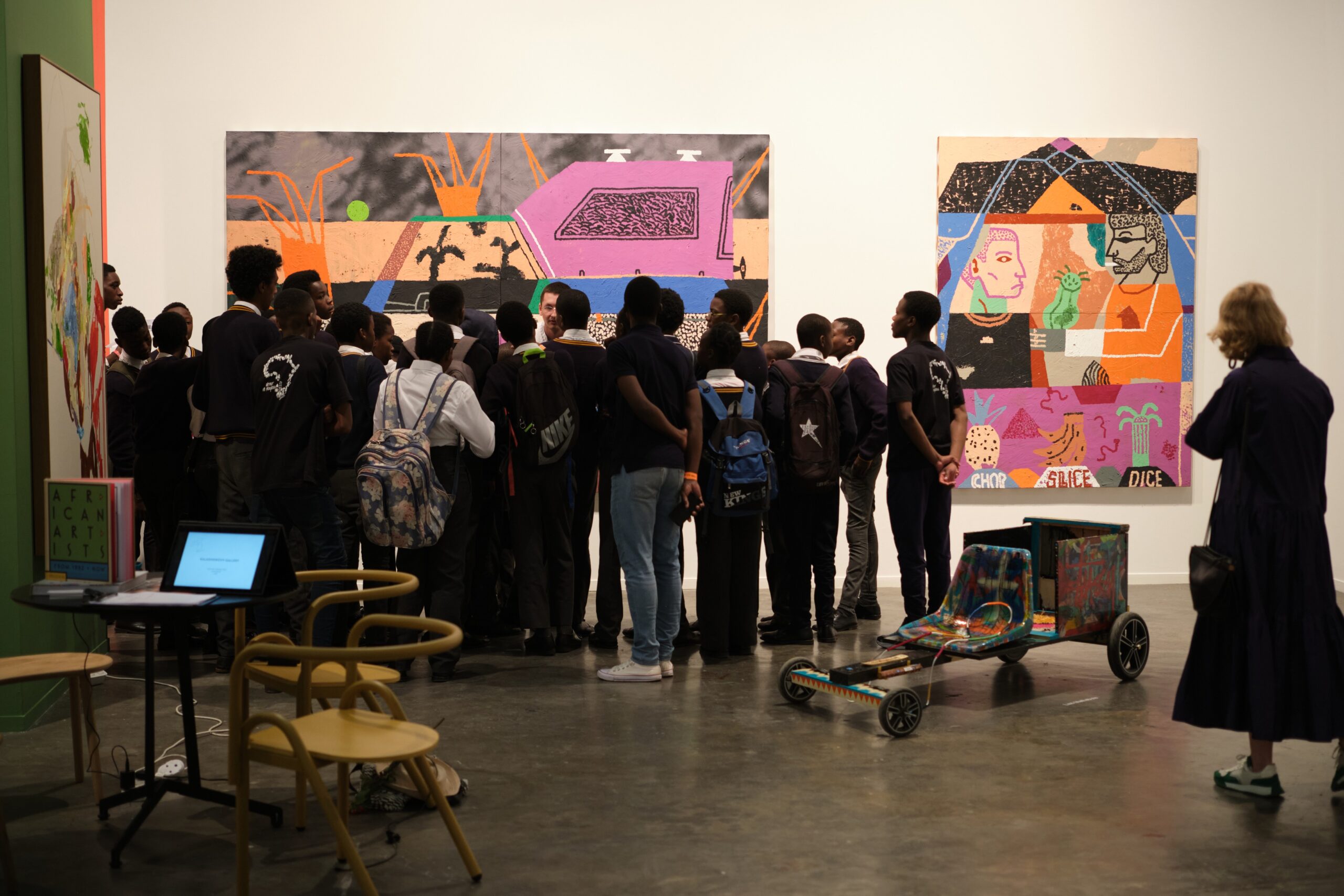 Students visit KALASHNIKOVV’s booth in the gallery HUB pavilion as a part of the educational programme during the 15th edition of FNB Art Joburg. (Image courtesy of FNB Art Joburg)