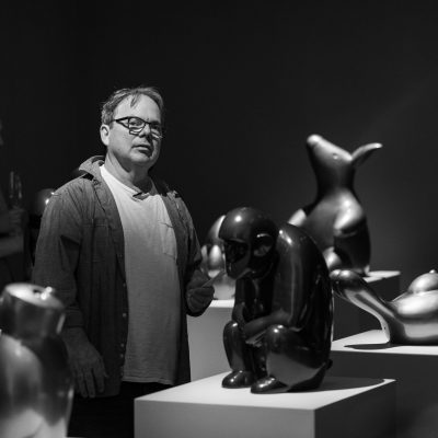 Brett Murray stands amongst his latest body of work titled Limbo currently showing at Everard Read CIRCA in Cape Town. (Image by Brandboom SA, courtesy of BMW Young Collectors Co.)